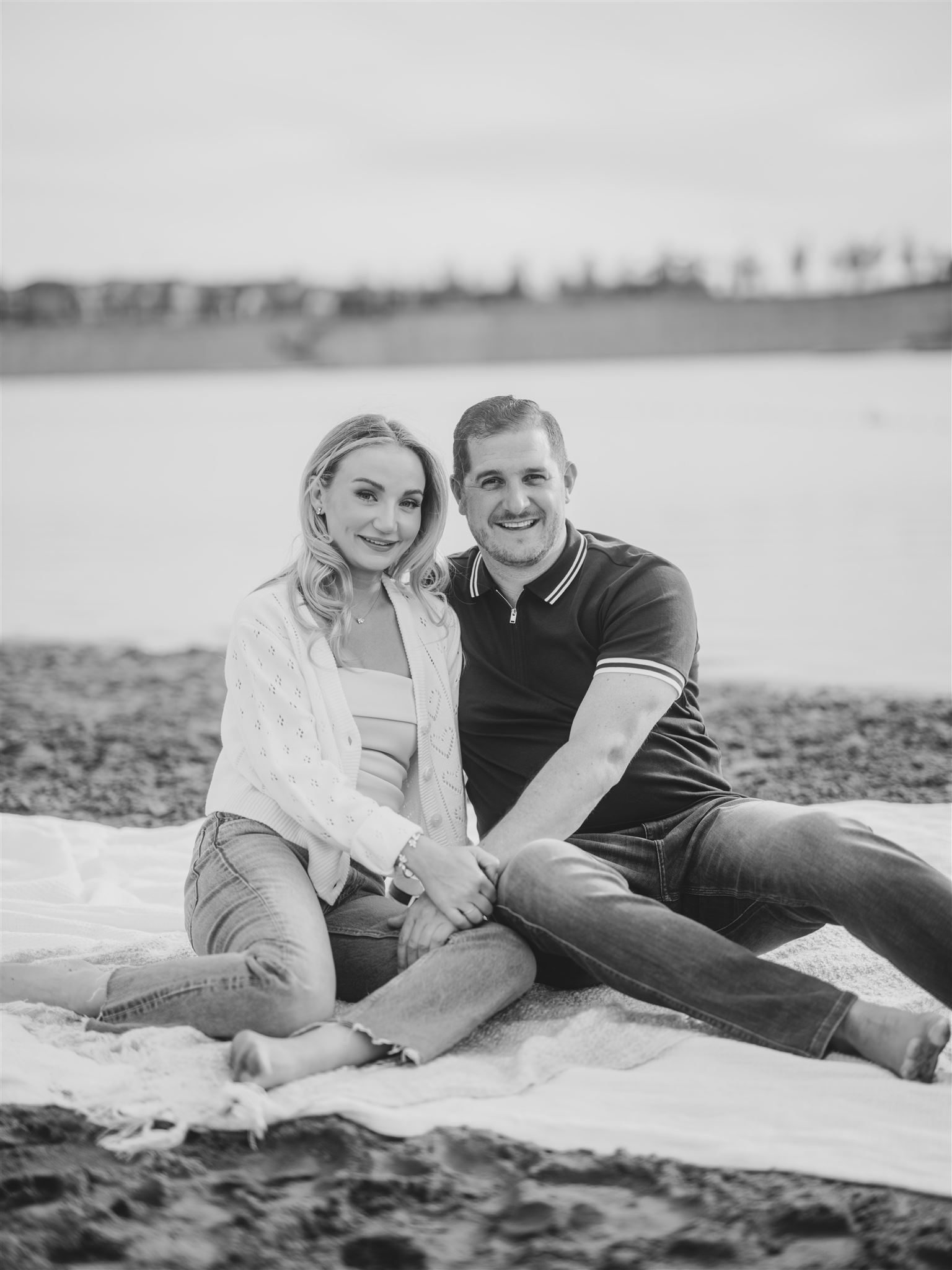 Summer Beach Engagement Calgary, beach engagement, summer engagement, cute summer engagement, sunset engagement on the beach, nicole sarah, couple cuddling on the beach, summer beach engagement outfits, engagement poses beach, running on the beach engagement